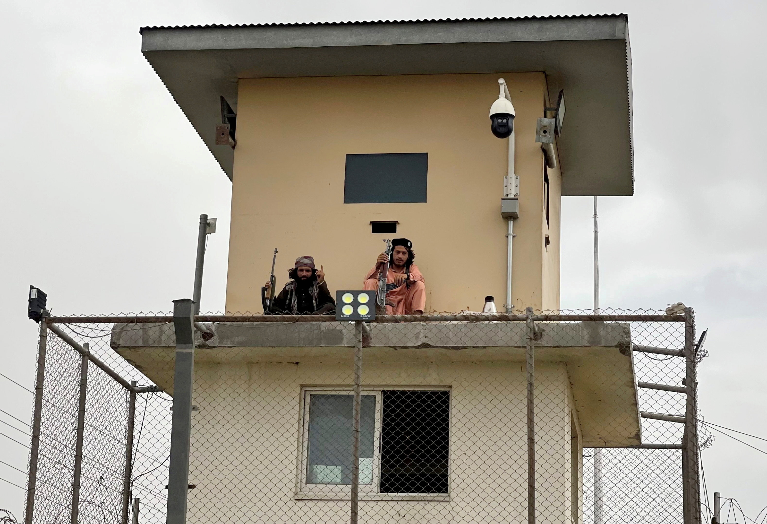 Taliban fighters man a security tower at the interior ministry in Kabul, Afghanistan, August 17, 2021. (Reuters)