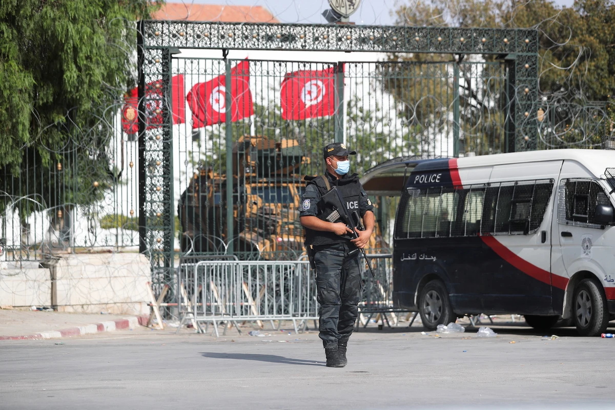 A police officer stands guard outside the parliament building in Tunis,Tunisia on July 29, 2021. (Reuters)