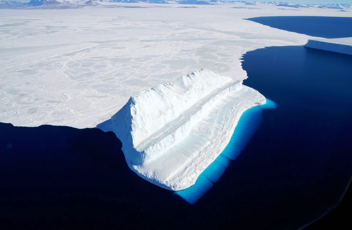 This file photograph shows a NASA image released on December 20, 2017, and taken November 29, 2017, by Operation IceBridge during a flight to Victoria Land, shows an iceberg floating in Antarctica's McMurdo Sound. (AFP)