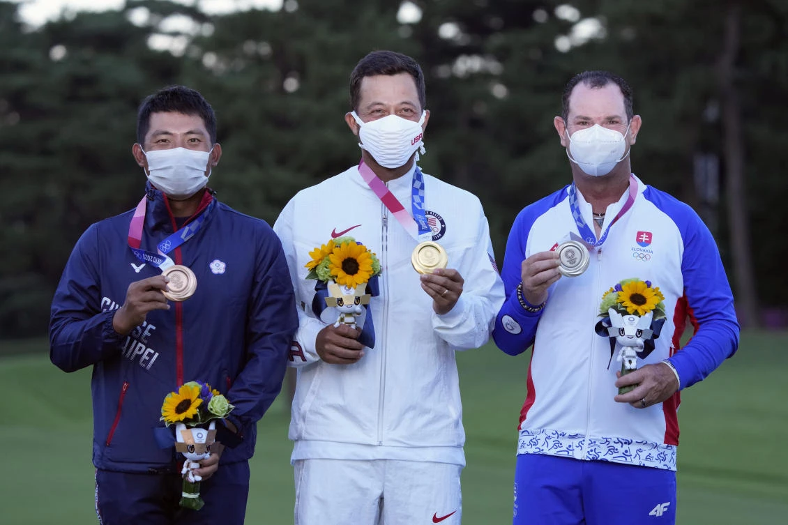 Xander Schauffele, of the US, poses with his gold medal next to bronze medal winner C.T. Pan of Taiwan, left, and silver medal winner Rory Sabbatini, of Slovakia, right, for the men's golf at the 2020 Summer Olympics. (AP)