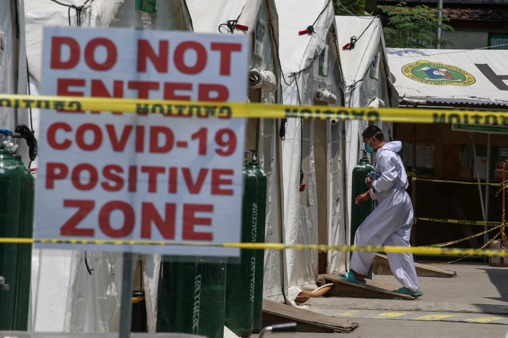 Metro Manila will shift to enhanced community quarantine, the strictest status, from Aug. 6 to Aug. 20 due to the threat of rising COVID-19 cases fueled by the Delta variant. (AFP)