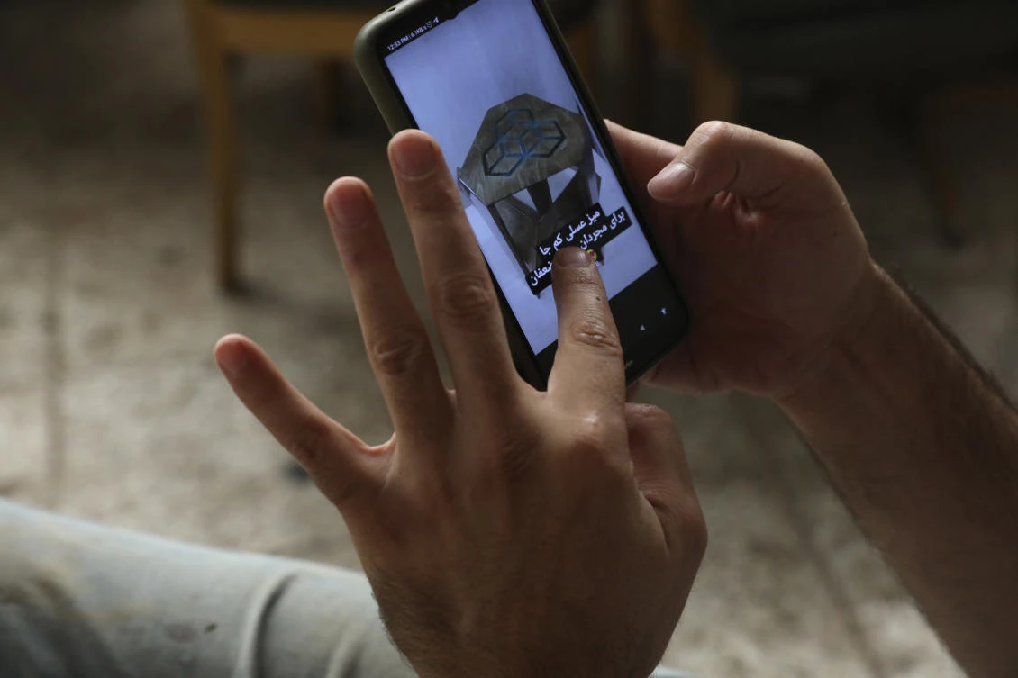 As the coronavirus ravages Iran, a growing number of people have turned to Instagram to make a living. (AP)