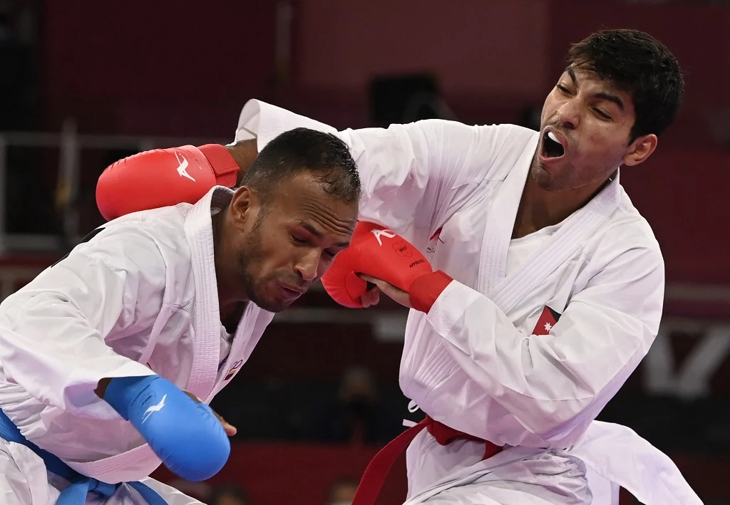 Jordan’s Abdel Rahman Almasatfa, right, competes against Venezuela’s Andres Eduardo Madera Delgado in the men’s kumite -67kg elimination round of the karate competition during the Tokyo 2020 Olympic Games. (AFP)