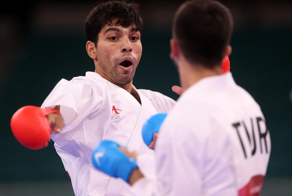 Abdel Rahman Al-Masatfa, left, of Jordan in action against Eray Samdan of Turkey in the 67kg karate kumite semifinal at the Nippon Budokan, Tokyo, Japan, August 5, 2021. (Reuters)