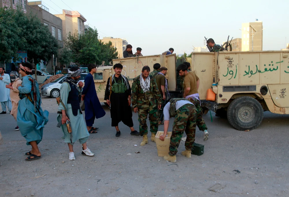 Private militia loyal to Ismail Khan, the former Mujahideen commander, after Afghan forces took back control of parts of Herat city from the Taliban, Afghanistan, Aug. 6, 2021. (AP Photo)