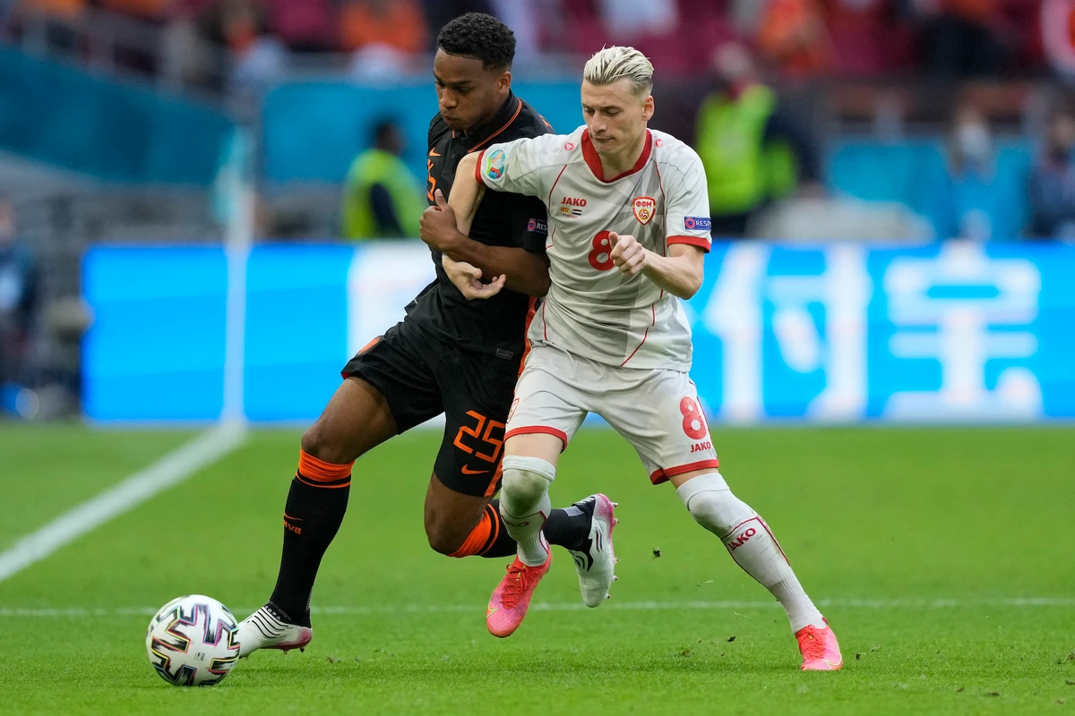 North Macedonia's defender Ezgjan Alioski and Netherland's defender Jurrien Timber vie for the ball during the UEFA EURO 2020 Group C football match. (File/AFP)
