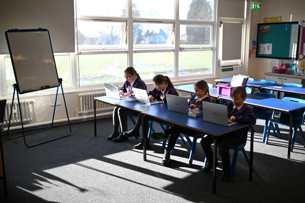 A Catholic school in England contacted counterterrorism experts following a dispute about a girl who wore hijab and refused to clap for Christian children. (File/AFP)