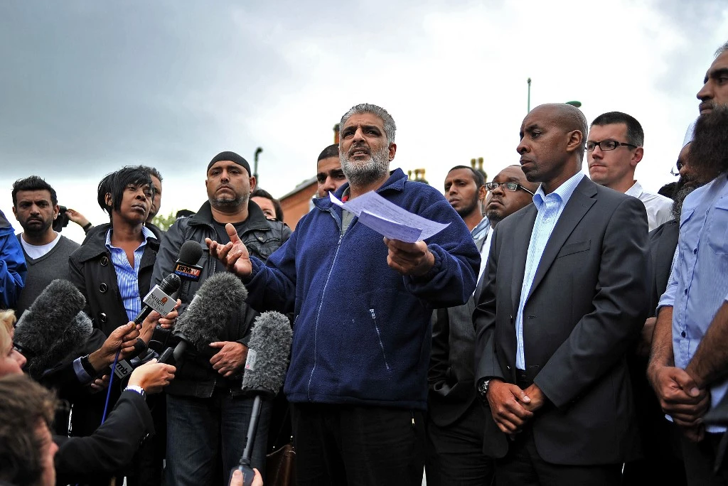 Tariq Jahan, father of Haroon Jahan, speaking near the crime scene where Haroon and two other Asian men were hit by a car and killed in August 2011. (AFP/File)