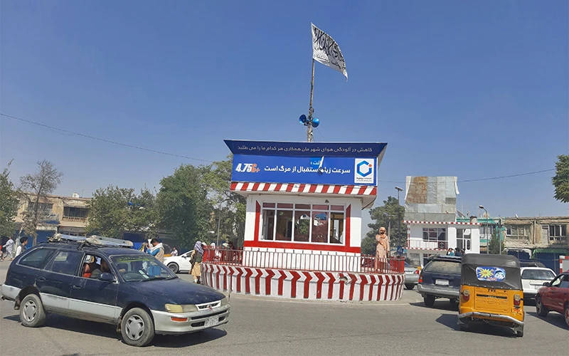 A Taliban flag flies in the main square of Kunduz city after fighting between Taliban and Afghan security forces, in Kunduz, Afghanistan, on August 8, 2021. (AP)