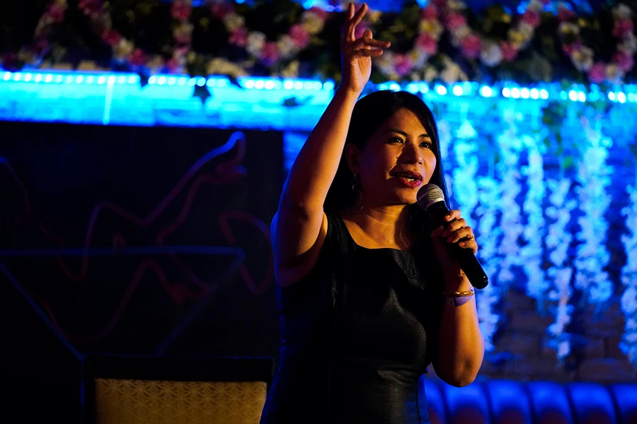 Filipina comedian Imah Dumagay performs stand-up comedy at an open-mic night at the Hi Five Restaurant & Lounge in Dubai, United Arab Emirates, Sunday, Aug. 8, 2021. (AP)