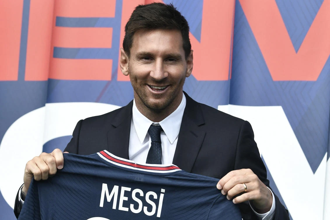 Argentinian football player Lionel Messi poses as he holds-up his number 30 shirt during a press conference at the French football club Paris Saint-Germain’s (PSG) Parc des Princes stadium in Paris on August 11, 2021. (File/AFP)