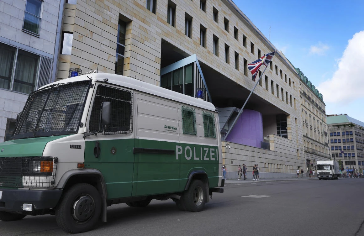 A police car is parked in front of the British embassy in Berlin on Wednesday. German prosecutors say they’ve detained a British citizen accused of spying for Russia while working at the Embassy. (AP)