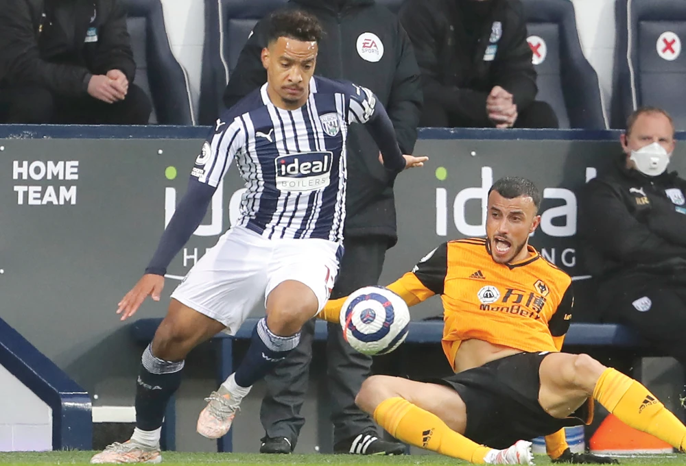 West Bromwich Albion’s Matheus Pereira, left, and Wolverhampton’s Romain Saiss during their Premier League match. Pereira has signed with Al-Hilal. (File/AP)
