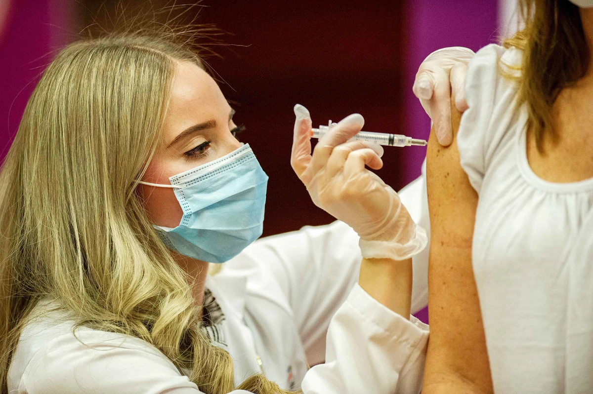 In this file photo taken on March 3, 2021 pharmacist Madeline Acquilano inoculates a teacher with the Johnson & Johnson Covid-19 Vaccine at Hartford Hospital in Hartford, Connecticut. (AFP)