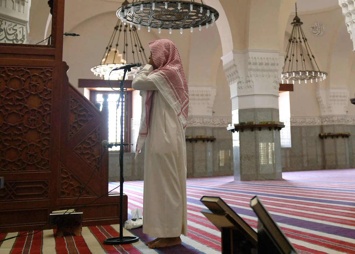 In this file photo taken on April 28, 2020, muezzin of the Jaffali mosque in Jeddah, calls for prayer at the mosque. (AFP)