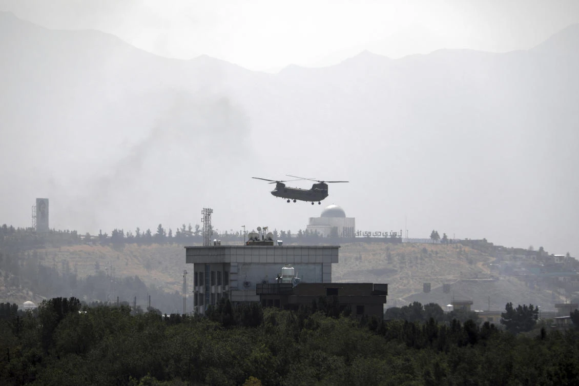 A US Chinook helicopter flies over the US Embassy in Kabul as they start evacuating staff on Aug. 15, 2021. (AP)