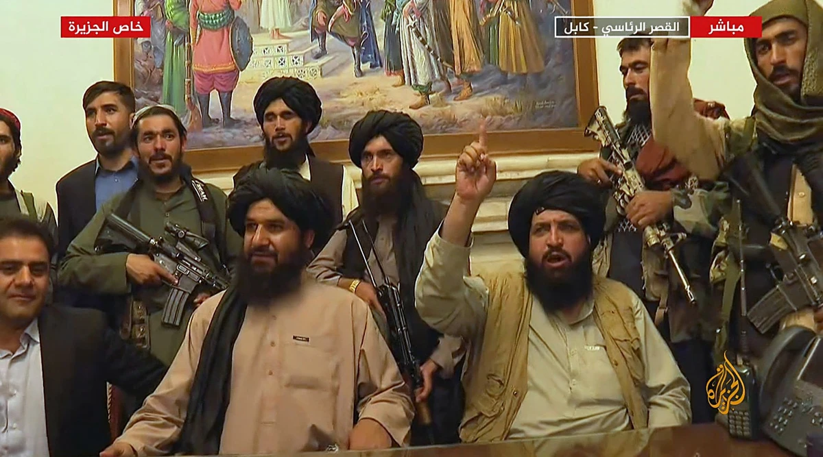 An image grab taken from Qatar-based Al-Jazeera television on August 16, 2021, shows Members of Taliban taking control of the presidential palace in Kabul after Afghanistan's president flew out of the country. (AFP)