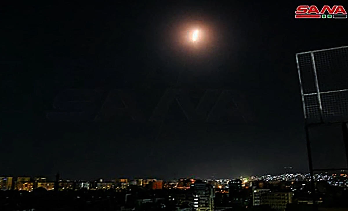 A handout picture released by the official Syrian Arab News Agency (SANA) on August 20, 2021 shows a light spot over the capital Damascus late on August 19, 2021. (File/AFP)