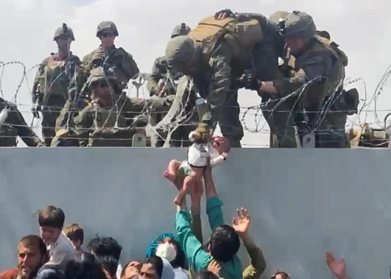 Viral footage of US Marine aiding baby captures Kabul chaos