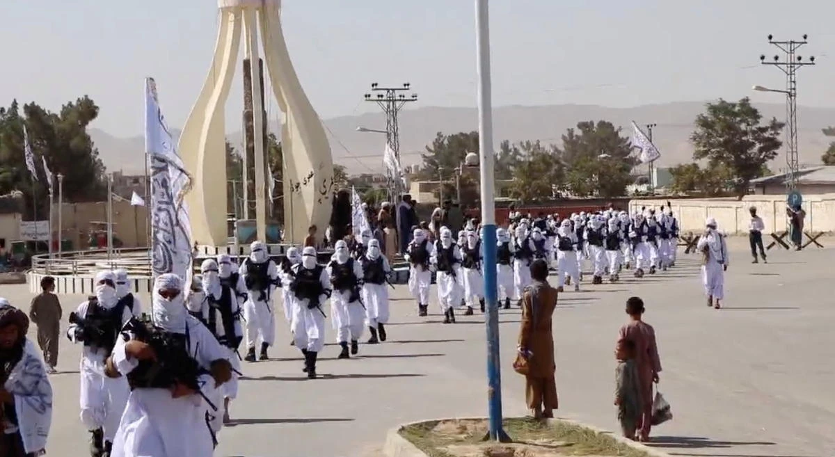 Taliban fighters march in uniforms on the street in Qalat, Zabul Province, Afghanistan, in this still image taken from social media video uploaded August 19, 2021. (Reuters)