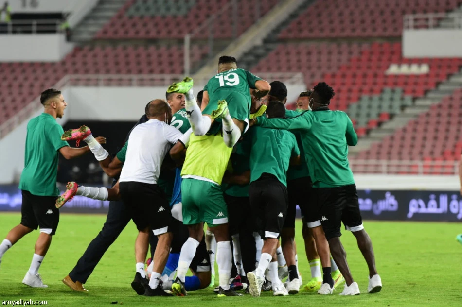 Raja Casablanca players celebrate winning the 2020 Arab Club Champions Cup after defeating Saudi Arabia’s Al-Ittihad 4-3 on penalties. (Arriyadiyah)