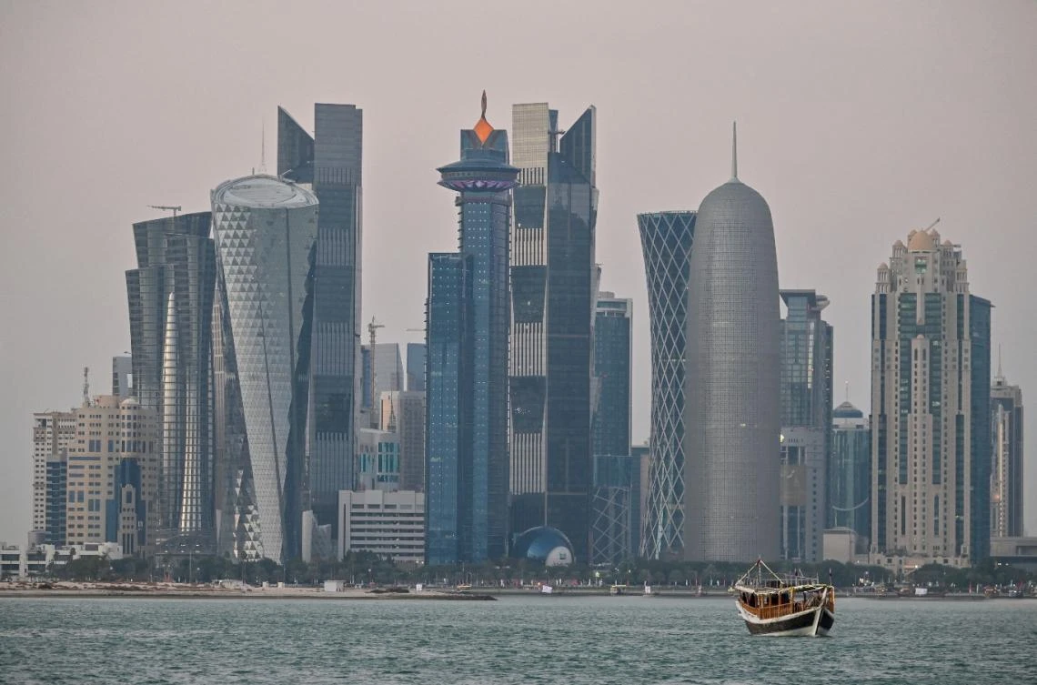 A general view taken on December 20, 2019 shows boats moored in front of the skyline of the Qatari capital, Doha. (File/AFP)