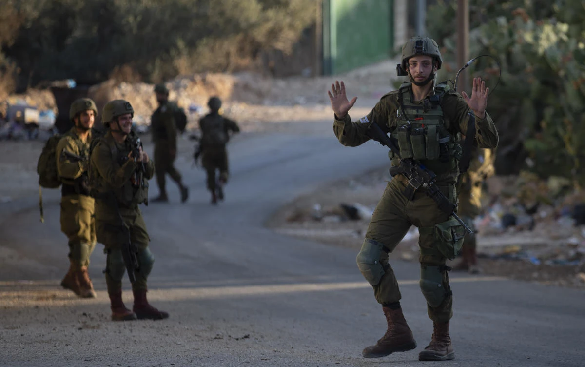 Israeli troops during an army operation following a stone throwing attack on an Israeli driver near the Allon Moreh Israeli settlement, at the West Bank village of Salem near Nablus on Monday, Aug. 23, 2021. (AP)