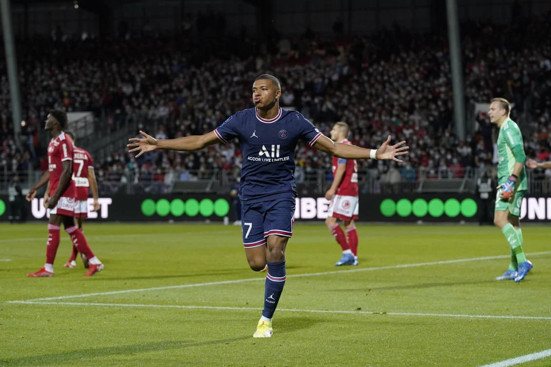 PSG’s Kylian Mbappe celebrates after scoring his side’s second goal during a French League One match against Brest on Friday. (AP)