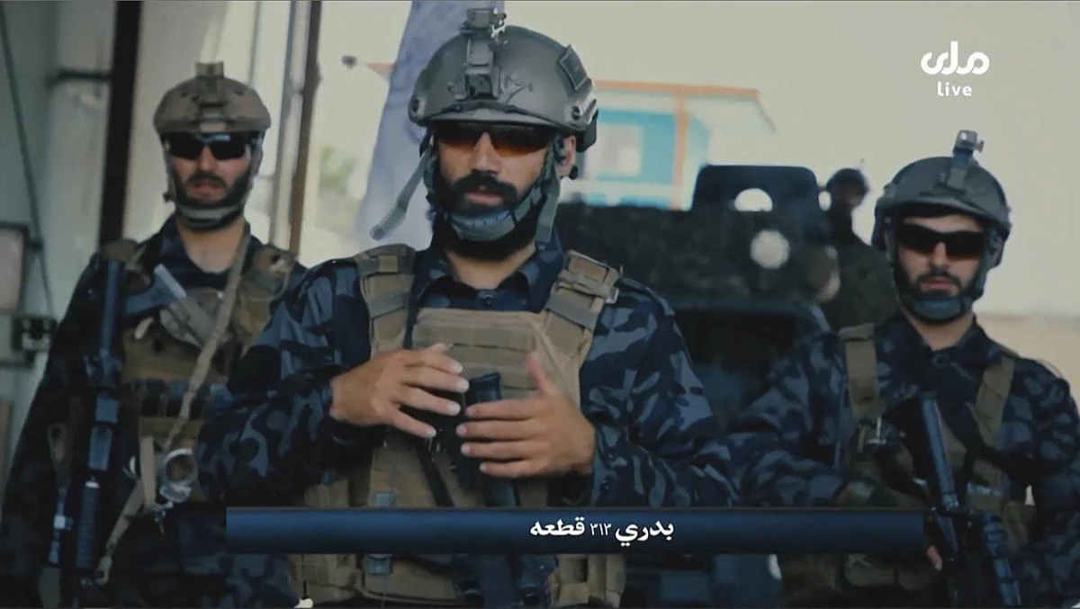 A video grab taken from Afghan TV RTA shows propaganda images of Taliban’s Badri 313 Special Forces patrolling streets in an unidentified location in Afghanistan. (AFP)