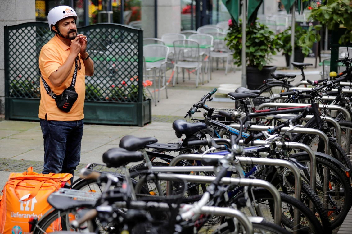 Former Afghan Communication Minister Sayed Sadaat works as a bicycle rider for the food delivery service Lieferando in Leipzig, Germany. (Reuters)