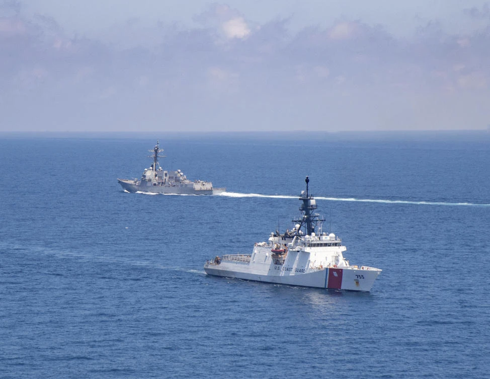 Legend-class US Coast Guard National Security Cutter Munro (WMSL 755) transits the Taiwan Strait with Arleigh Burke class guided-missile destroyer USS Kidd (DDG 100) on Aug. 27, 2021. (US Coast Guard via AP)