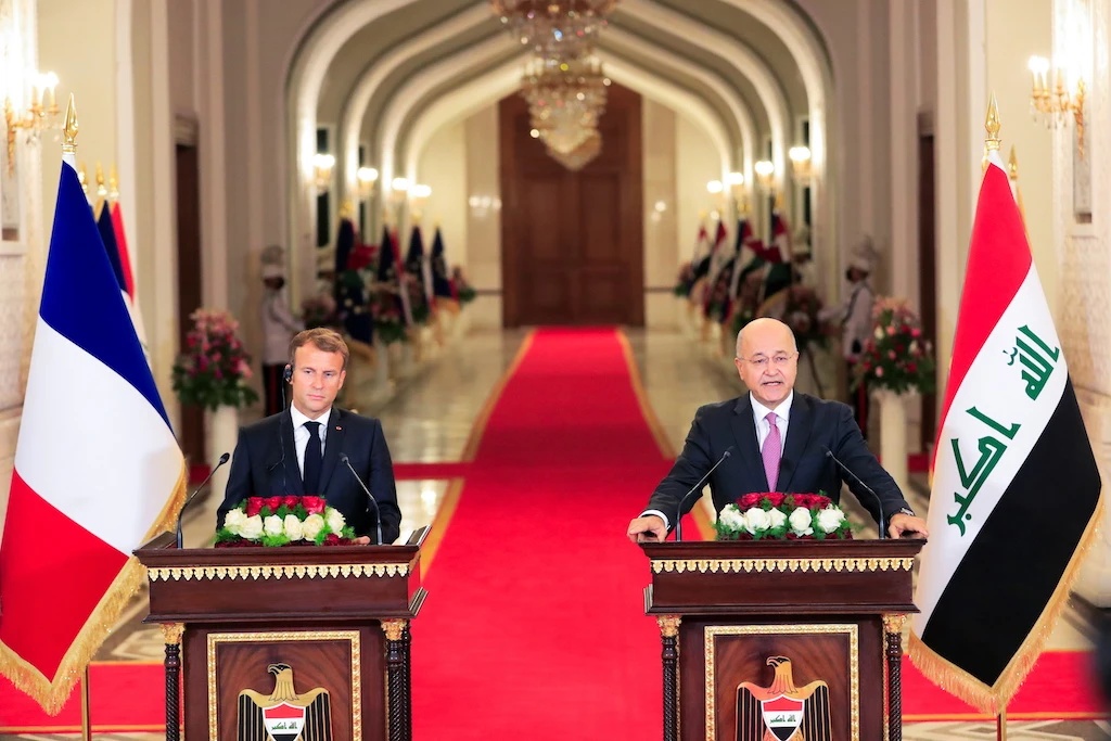 Iraq's President Salih and France's President Macron attend a news conference in Baghdad. (Reuters)