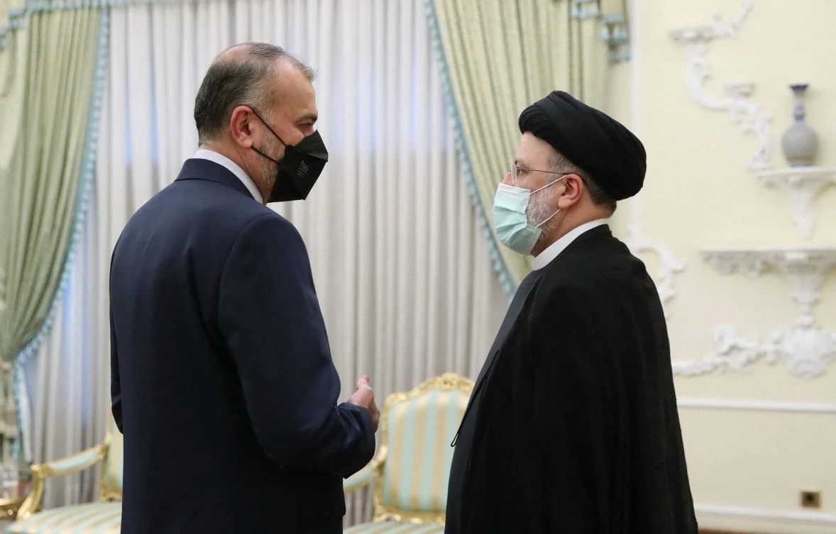 Iranian president Ebrahim Raisi, right, talks with foreign minister Hossein Amirabdollahian, who received 270 votes from lawmakers. (Iranian presidency/AFP)