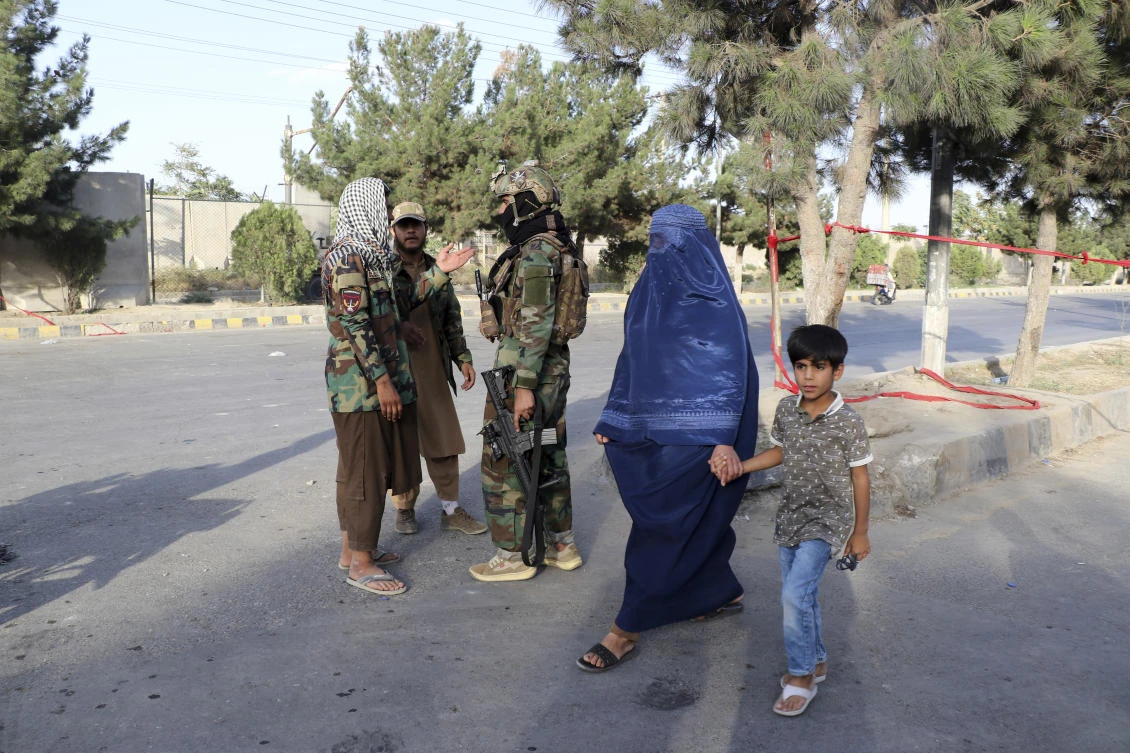 Taliban fighters stand guard at a checkpoint near the gate of Hamid Karzai international Airport in Kabul, Afghanistan, Saturday, Aug. 28, 2021. (AP)