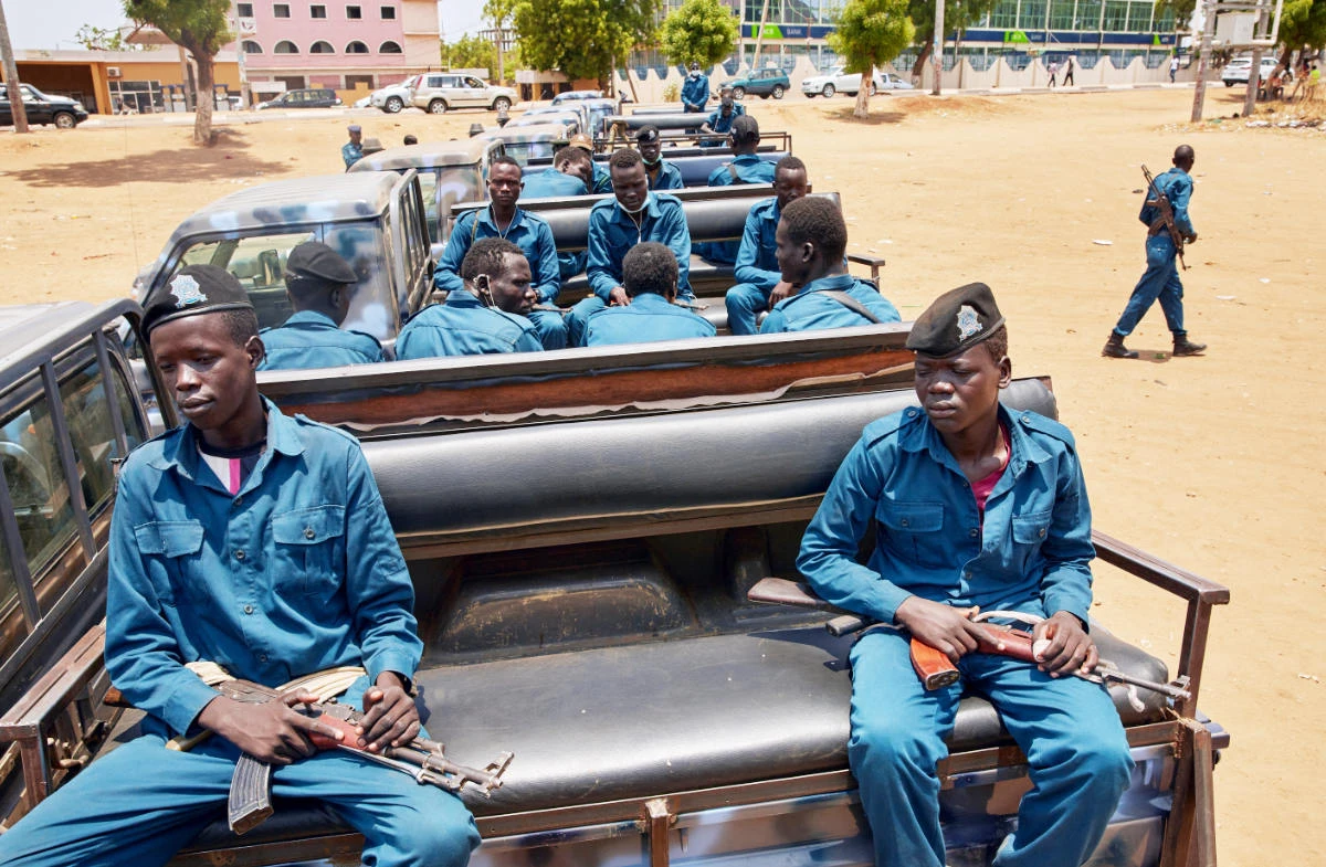 SSNPS (South Sudan National Police Service) police officers sit on the back of a pickup truck while they gather ahead of patrolling the streets of Juba, South Sudan. (AFP)