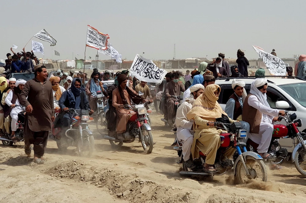 Taliban supporters near the Friendship Gate crossing at Spin Boldak/Chaman on the Afghanistan-Pakistan border, July 14, 2021. (Reuters)