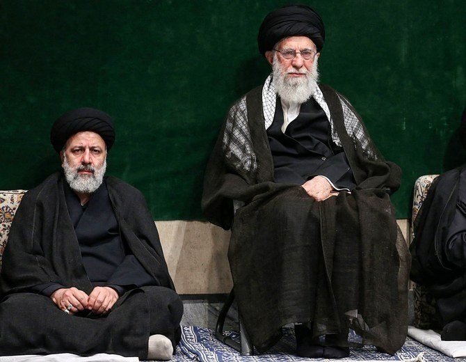 Ebrahim Raisi, left, with Supreme Leader Ayatollah Ali Khamenei. (AFP)