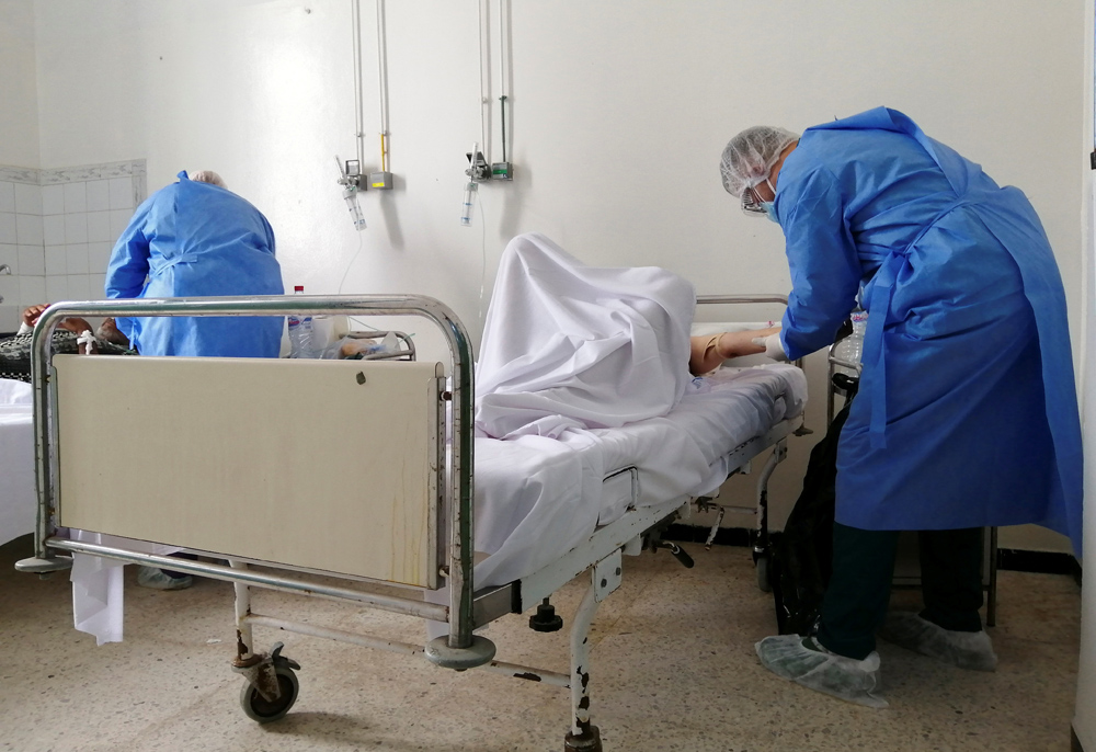 Medical staff assist patients suffering from the coronavirus disease (COVID-19), Charles Nicole Hospital, Tunis, Tunisia, July 13, 2021. (Reuters)