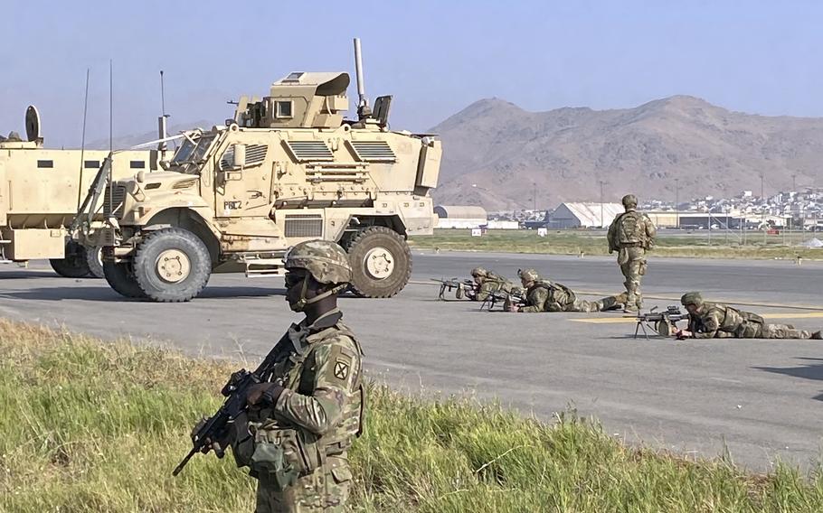 U.S. troops stand guard along a perimeter at the international airport in Kabul, Afghanistan, Monday, Aug. 16, 2021. (AP Photo)