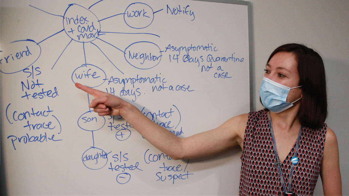 A health investigator in Salt Lake City shows contact tracers how to find and contact people after someone tests positive for COVID-19. (AP Photo)