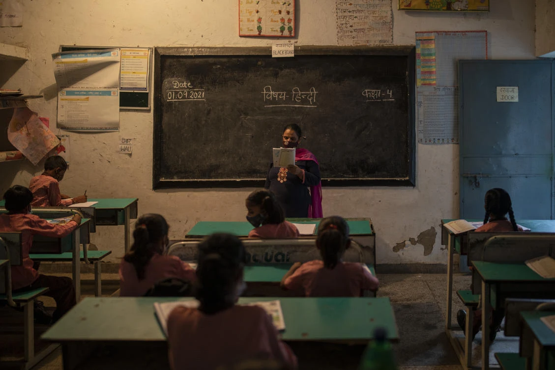 In New Delhi, only students in grades nine through 12 will be allowed to attend at first, though it is not compulsory. (AP)