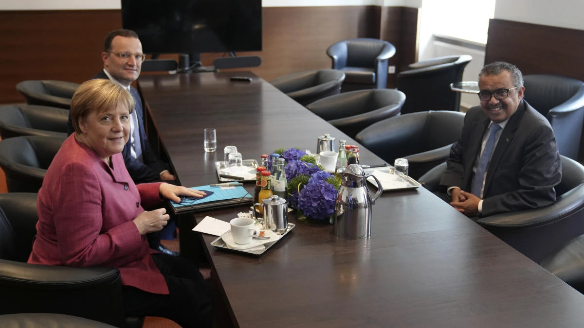 Tedros Adhanom Ghebreyesus, WHO’s Director-General, Germany’s Health Minister Jens Spahn and Chancellor Angela Merkel meeting before inauguration ceremony of the ‘WHO Hub For Pandemic And Epidemic Intelligence’ in Berlin on Wednesday. (AP)