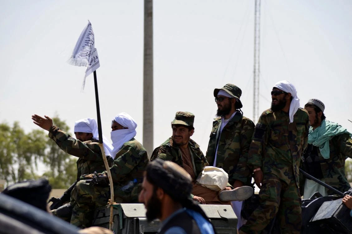 Taliban fighters atop an armoured vehicle parade along a road to celebrate after the US pulled all its troops out of Afghanistan, in Kandahar on September 1, 2021. (AFP)