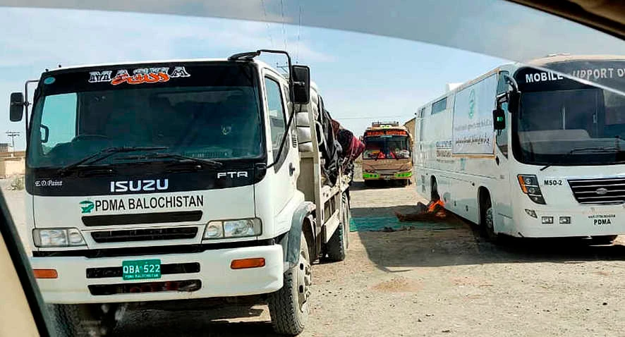 Mobile medical screening unit and cargo trucks park at the closed Pakistan-Iran border crossing, Feb. 25, 2020, in Taftan, Pakistan. (AP)