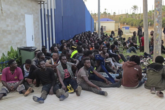 File photo of migrants at a migrant processing center in Melilla, Spain. A humanitarian aid group that monitors migrants’ plight taking perilous seaborne routes to Spain said 21 women and a girl have died. (AP)