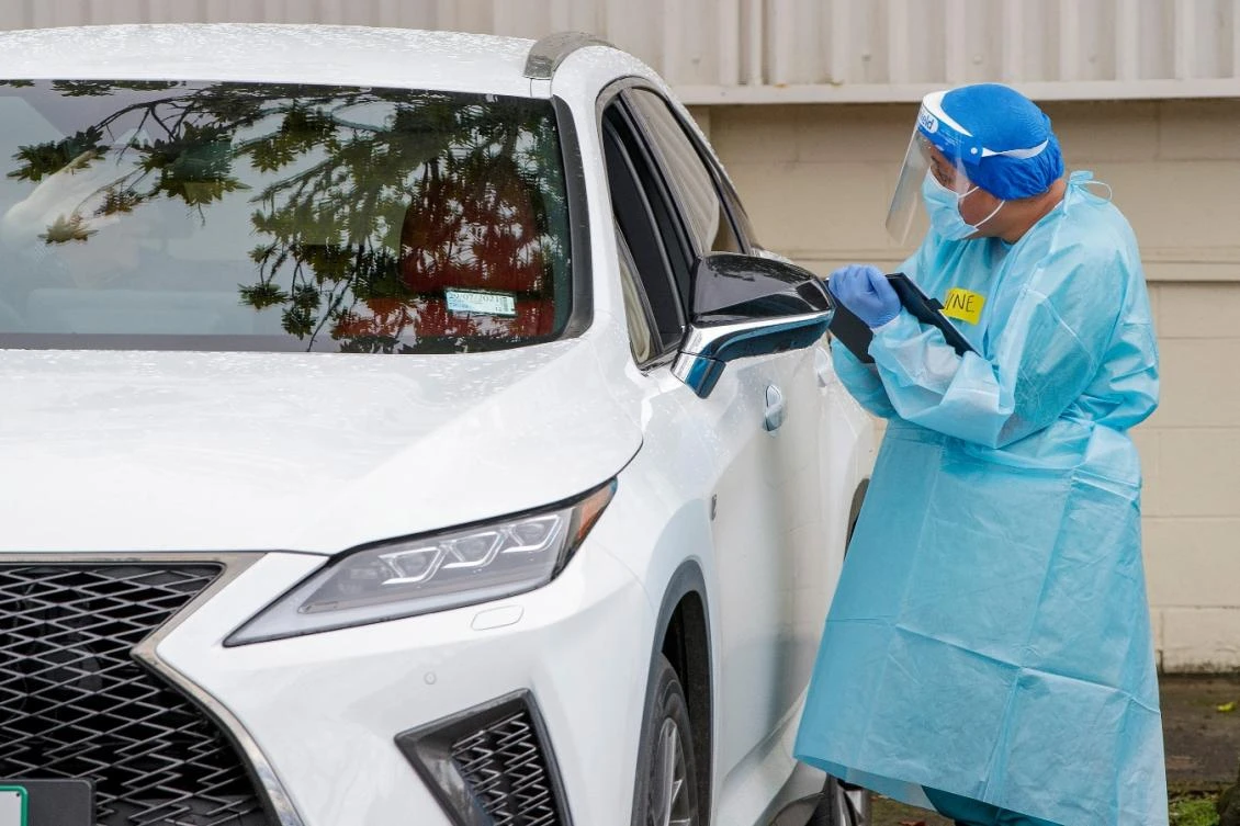 A health worker conducts a test at a COVID-19 coronavirus testing centre in the suburb of Northcote in Auckland on August 12, 2020. (File/AFP)