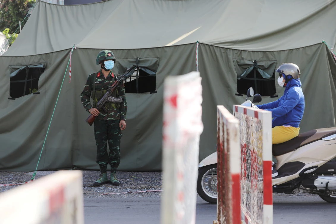 A military checkpoint is seen during lockdown amid the COVID-19 pandemic in Ho Chi Minh at Vietnam, where a court jailed a man on Monday 5 years for breaking strict COVID-19 quarantine rules and spreading it to others. (Reuters)