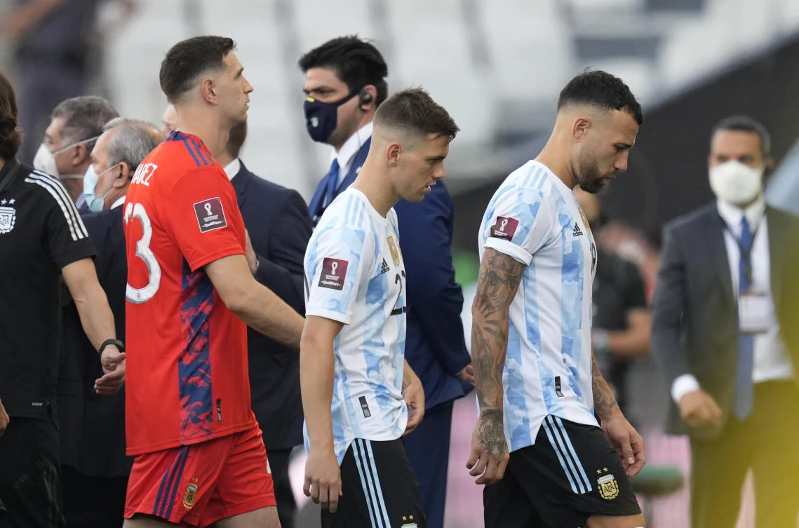 Argentina’s players Nicolas Otamendi, Giovani Lo Celso and goalkeeper Emiliano Martinez, walk off the field after the match for FIFA World Cup Qatar 2022 against Brazil was interrupted by health officials in Sao Paulo on Sunday. (AP)