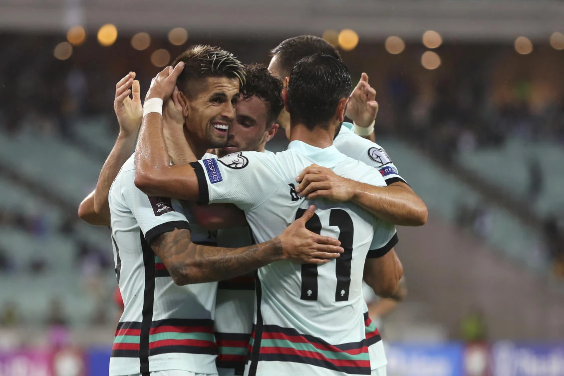Portugal players celebrate after Diogo Jota scored his side’s 3rd goal during the World Cup 2022 group A qualifying match against Azerbaijan at the Olympic stadium in Baku on Tuesday. (AP)
