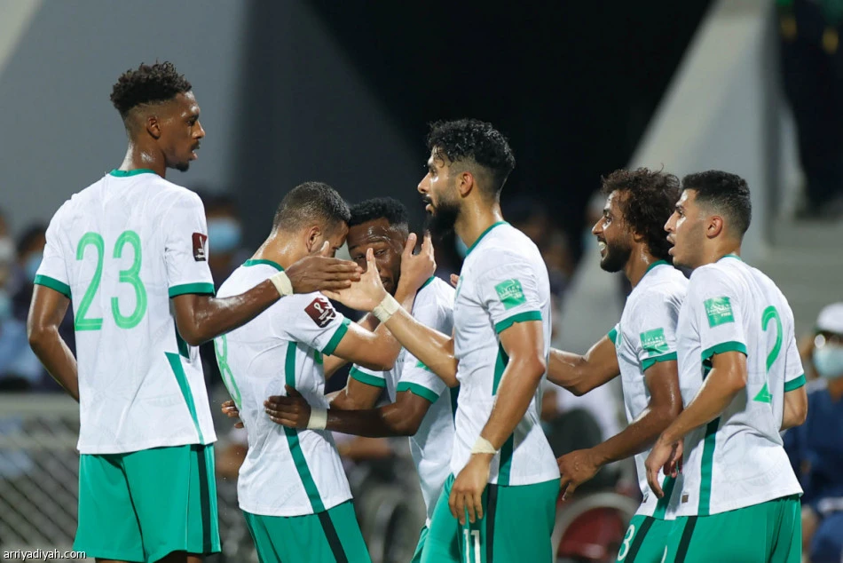 Saudi players celebrate Saleh Al-Shehri's goal against Oman in Muscat. (Arriyadiyah)